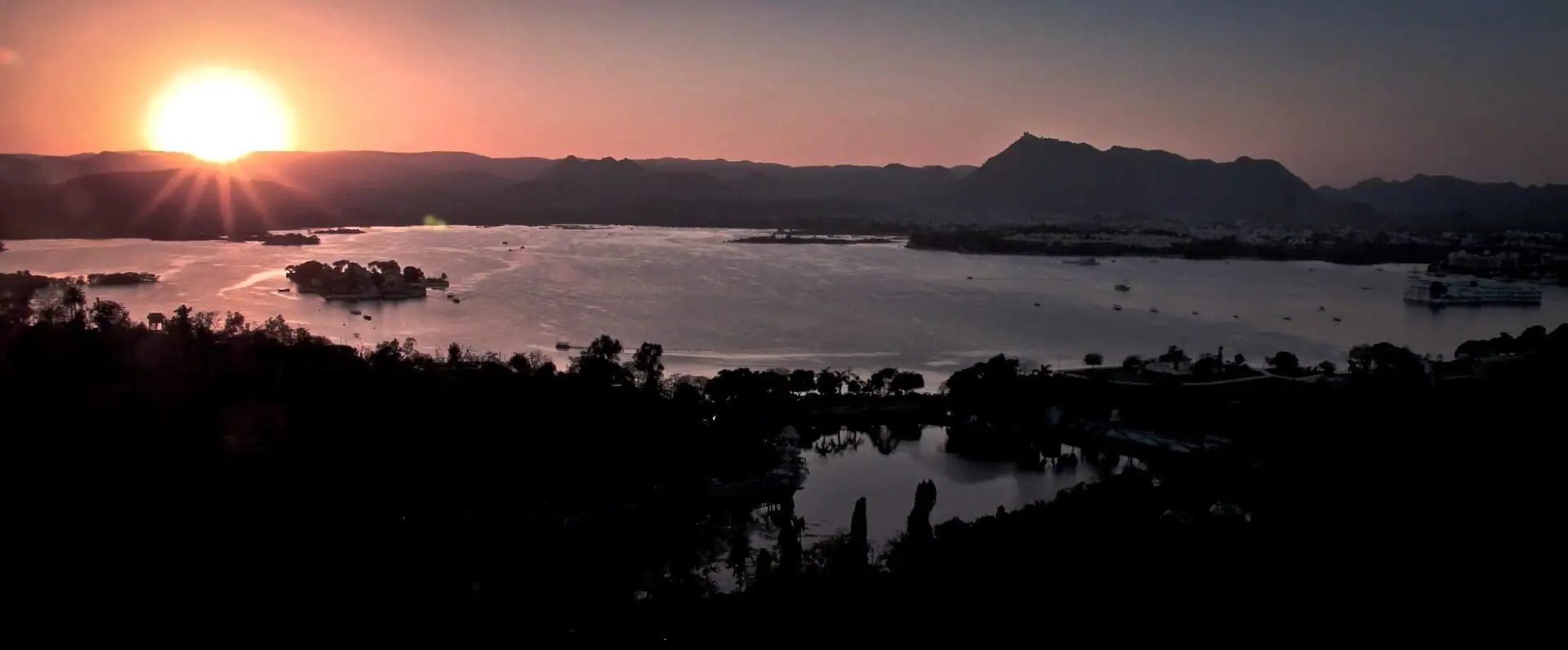 The Aravalli hills and Lake Pichola after sundown